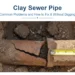 Cracked clay sewer pipe with a separated joint exposed in Arizona soil