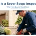 Technician running a sewer camera inspection at an Arizona home